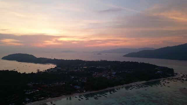 Koh Lipe, Thailand: Aerial orbit drone footage over Koh Lipe, an island in Andaman sea of Thailand. Taken with orbit motion at dramatic sunset