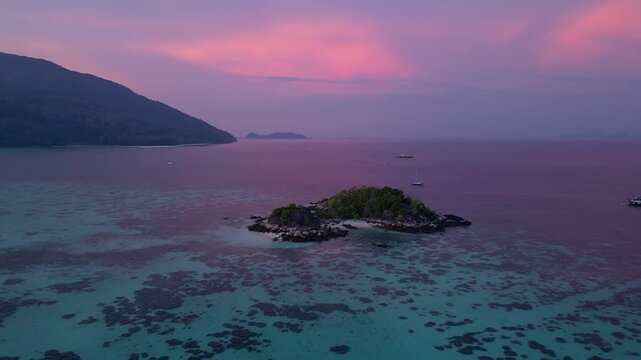 Koh Lipe, Thailand: Aerial drone footage of islets in Koh Lipe, an island in Andaman sea of Thailand. Taken with tilt up and forward motion on beautiful sunset