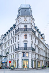 Fototapeta premium Historic Corner Building and Clock Tower, Kongens Nytorv, Copenhagen, Denmark