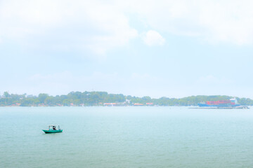 Obraz premium Small boat in the Sea, Pulau Ubin Singapore