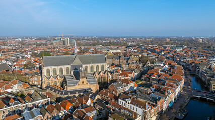 Obraz premium Historic canal city with prominent church tower in Europe