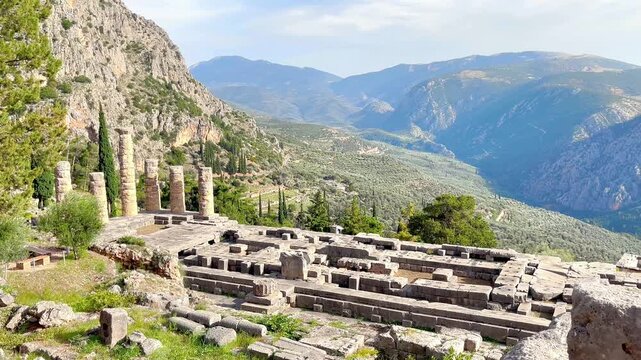 ancient temple of apollo in delphi greece, archaeological site on mount parnassus, conceptual sanctuary of the oracle and classical greek civilization, ruins with panoramic mountain view