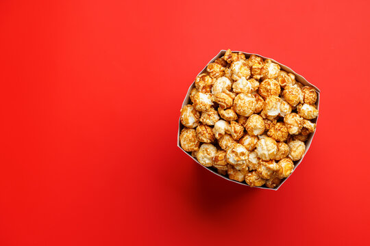 Popcorn bucket on bright red background