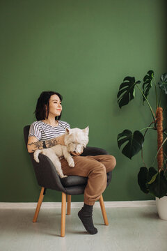 Woman relaxing with pet dog at home