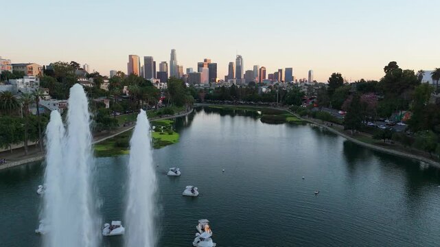 Echo Park Lake with Downtown Los Angeles skyline at sunset California, November 25 2025