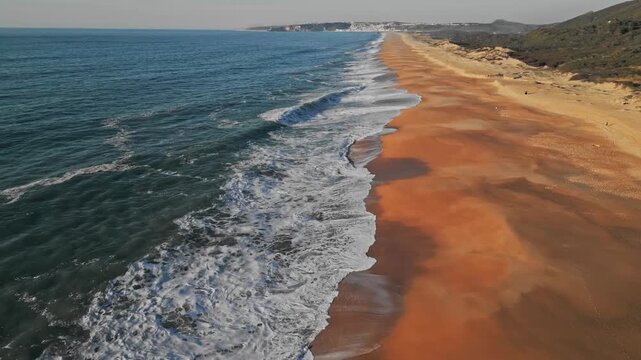 Aerial view of Praia do Salgado's golden sands in Nazare, Portugal