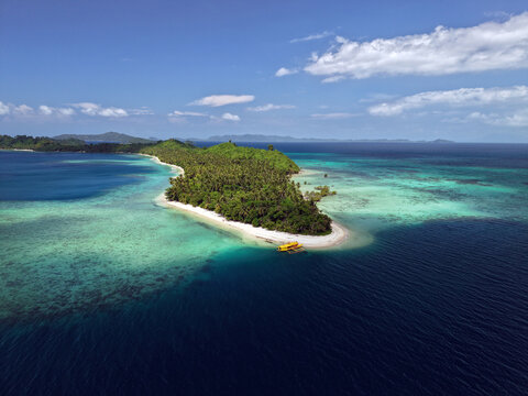 Aerial drone view of Maxima Island lies off the coast of Port Barton beach village in San Vicente town, Palawan, Philippines