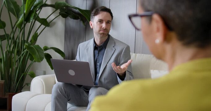 Financial advisor in a meeting with a customer on Sofa