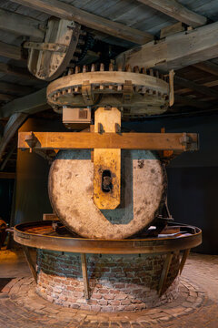 Historic millstone and wooden gear mechanism, Arnhem museum