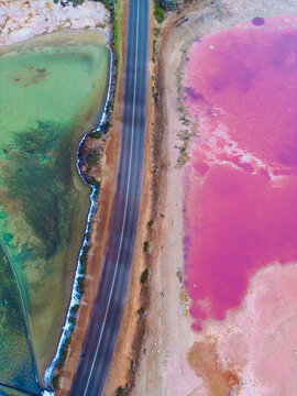  Aerial view of Hutt Lagoon with pink lake and coastal road, Western Australia