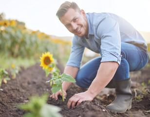 Fototapeta premium Smiling young gardener planting sunflower seedlings in rich soil. An uplifting scene representing growth, sustainability, and organic farming, ideal for ecology and business marketing.