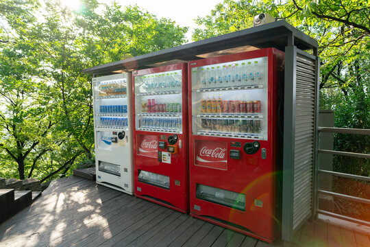 Vending machines standing on outdoor wooden deck
