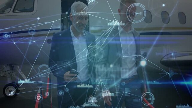 Two men leaving jet stairs and passing ropes, phone guiding animated business data, heading to meet