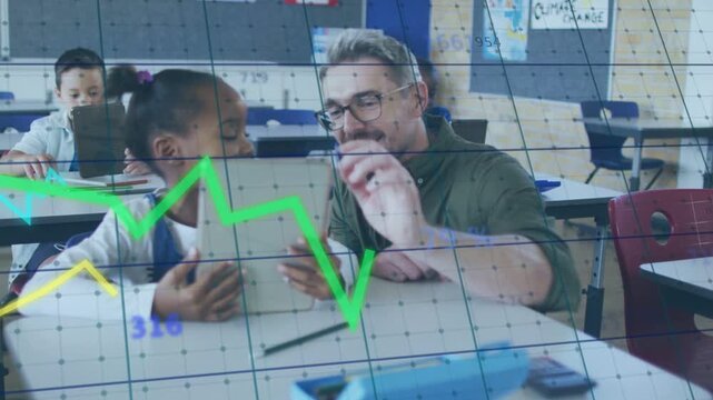 Pointing teacher tapping tablet at desk guiding girl holding tablet in blue overall with grid