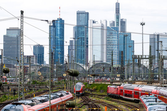 Urban transport scene with train and railway tracks in bankenviertel frankfurt germany where skyline infrastructure meets daily commuting