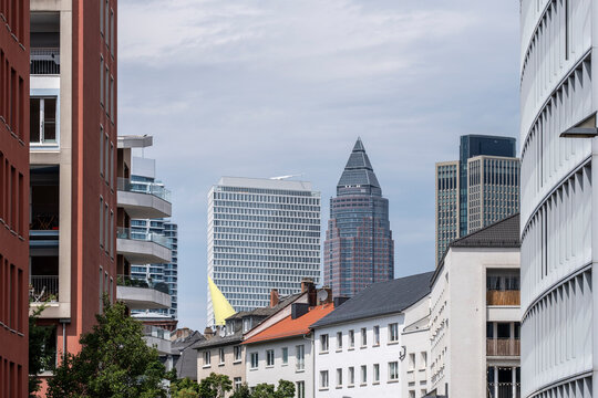 Urban street scene in bankenviertel frankfurt germany where city skyline and office tower architecture rise behind historic buildings