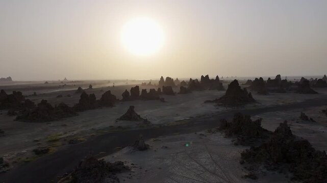 Drone view of barren desert landscape with isolated rock formations near the Red Sea, wide aerial footage.