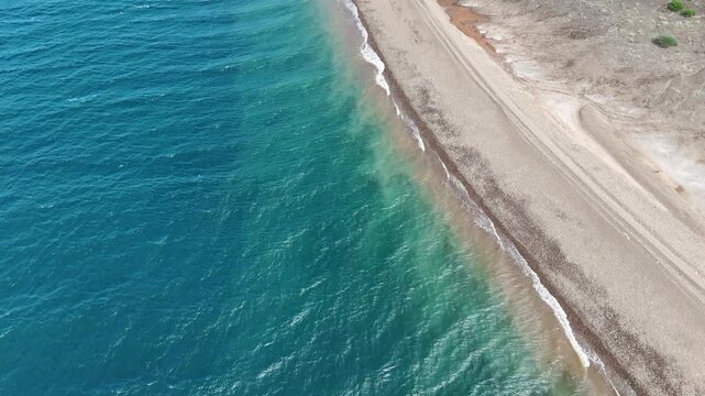 Aerial footage of Red Sea shoreline in Djibouti with clear ocean water