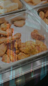 Vertical video: Metal tray with fried wings, charts appearing while camera shifting right for data
