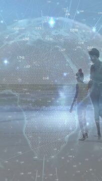 Parent and child exploring shore, child letting go stepping toward water, data globe overlay scene