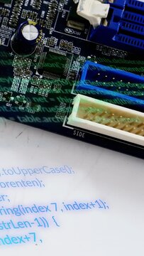 Vertical video: Capacitor focus cueing cam sweep across PCB, refocusing to show connectors for test