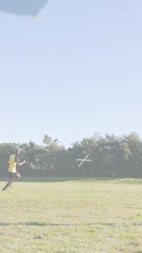 Vertical video: Soccer training: player preparing and throwing ball with animated arc tracking