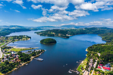 Fototapeta premium Aerial view of Grodek nad Dunajcem village, Lake Roznow and Beskidy mountains in Poland