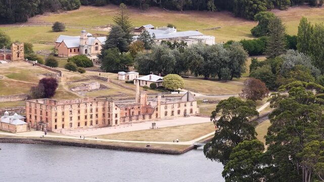 Bay at Port Arthur historic penitentiary jail colonial time in Tasmania &ndash; aerial landscape.
