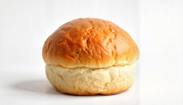 Soft bread bun with golden crust on a white background  