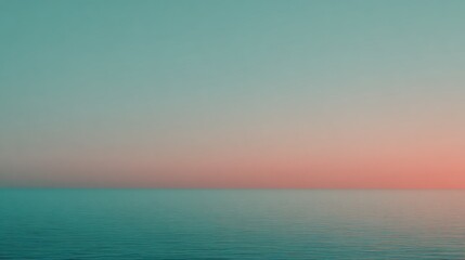 Obraz premium Tranquil ocean horizon at sunset with gradient sky and calm water