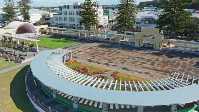 A scenic aerial view of the Napier Soundshell and gardens in Napier, New Zealand. The open-air venue is a popular spot for events and gatherings. Marine Parade.