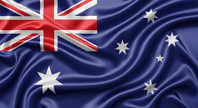 The Australian national flag waving with blue field and white stars and Union Jack in the upper left corner.