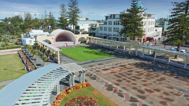 A scenic aerial view of the Napier Soundshell and gardens in Napier, New Zealand. The open-air venue is a popular spot for events and gatherings. Marine Parade.