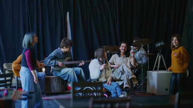 A group of students collaboratively rehearses their music, creating harmonious sounds together. Young musicians showcase their talent and passion for music in a lively, inclusive band practice.