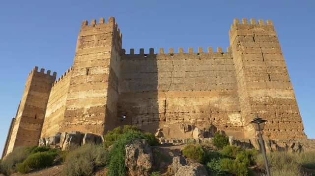 Low angle shot of the historic Burgalimar Castle in Banos de la Encina, Spain. Built in the 10th century, it is one of the best preserved Umayyad fortresses in Europe.