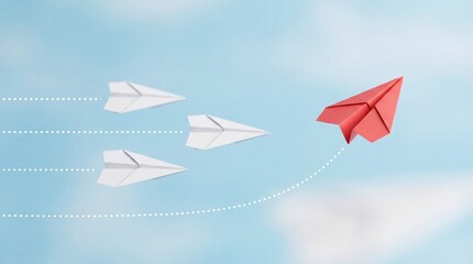 Fototapeta premium Red paper airplane leads white planes in innovative flight path
