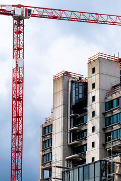 Frankfurt crane supports urban construction of highrise building structure during development where architecture and engineering shape the skyline