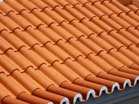 Terracotta roof tiles in close up with Mediterranean architecture detail