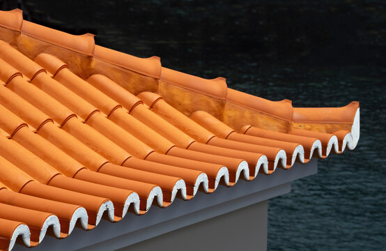 Terracotta roof tiles in close up with Mediterranean architecture detail