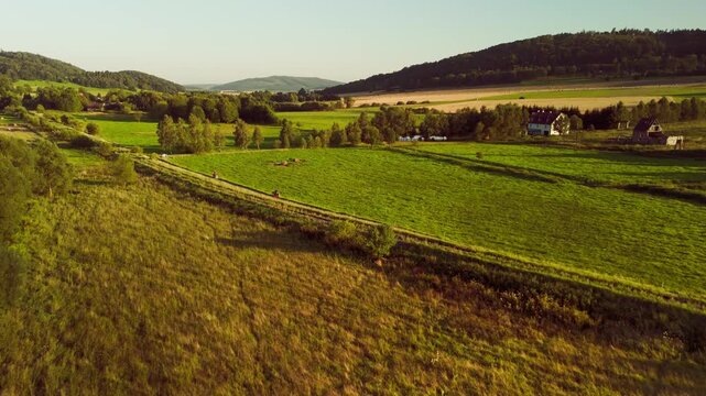 Aerial Drone View of Agricultural Fields in Mountainous Lower Silesia at Sunset, Golden Hour Landscape