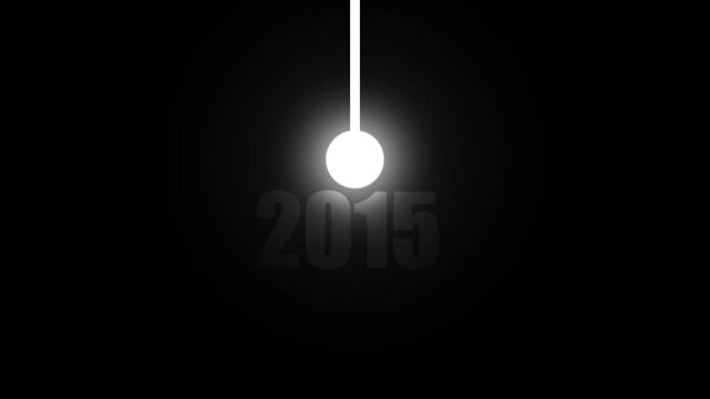 A glowing white sphere suspended by a white rod against a dark background with the year 2015 subtly displayed in gray text keywords: sphere, glowing, light, bright, white, dark, black