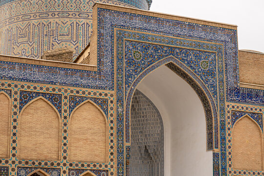 Facade of Gur-e-Amir - a mausoleum of the Asian conqueror Timur. Translation on mosque: Tamerlane. Famous travel destination in Uzbekistan