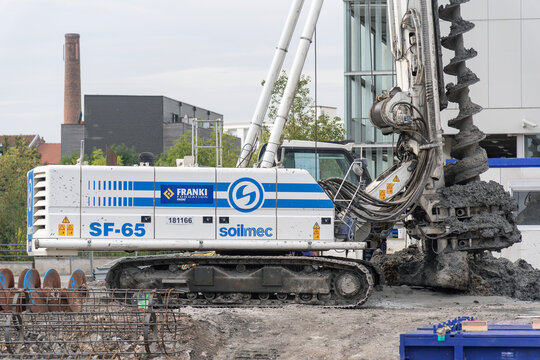 Nancy, France - September 12th 2019 : View on a white piling rig Soilmec SF-65 for special foundations on a construction site before the construction of a residential building.