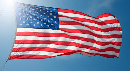 Obraz premium Waving american flag against a bright blue sky symbol of freedom and patriotism