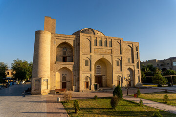 Obraz premium Beautiful historical buildings in the Old Town of Bukhara, Uzbekistan. Blue sky with copy space for text