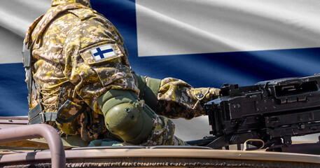 Finland flag with soldier at machinegun turret © lucky pics