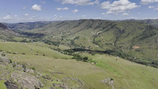 Drone flies over mountainous landscape on a sunny day at Sibebe Rock near Mbabane, Eswatini