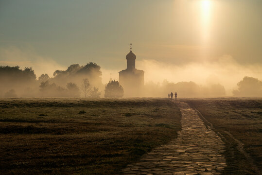 Silhouette of the ancient Church of the Intercession on the Nerl in the fog at dawn, Bogolyubovo. Golden Ring of Russia