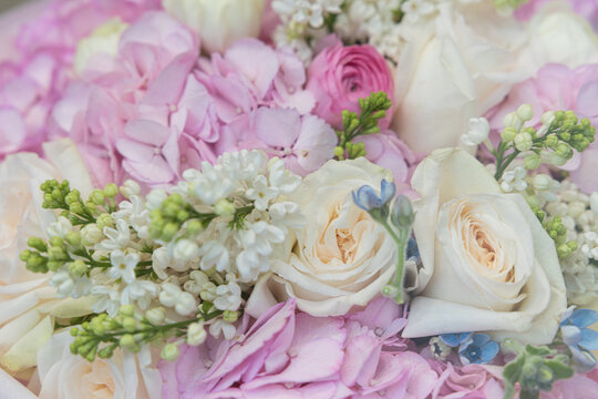 Pastel flower bouquet with white roses, pink hydrangea, and lilac