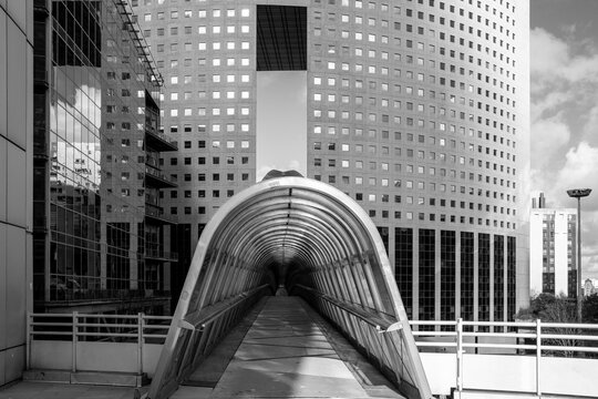 Modern urban business district in Paris France with architecture around a bridge landmark captured in bold monochrome tones with strong city presence
